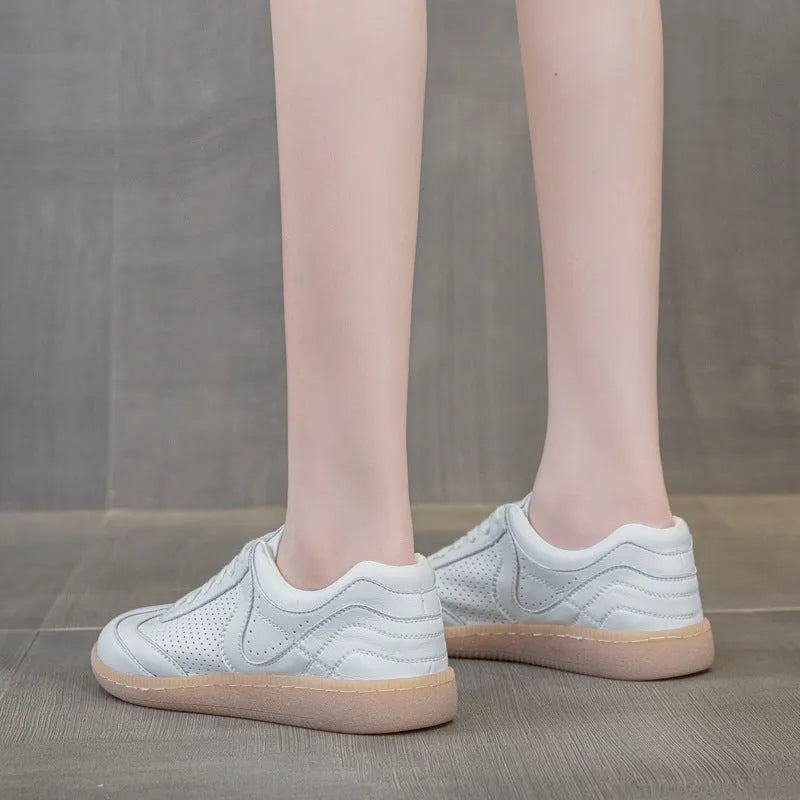 Breathable hollow casual shoes in white with cowhide upper, flat heel, and round toe