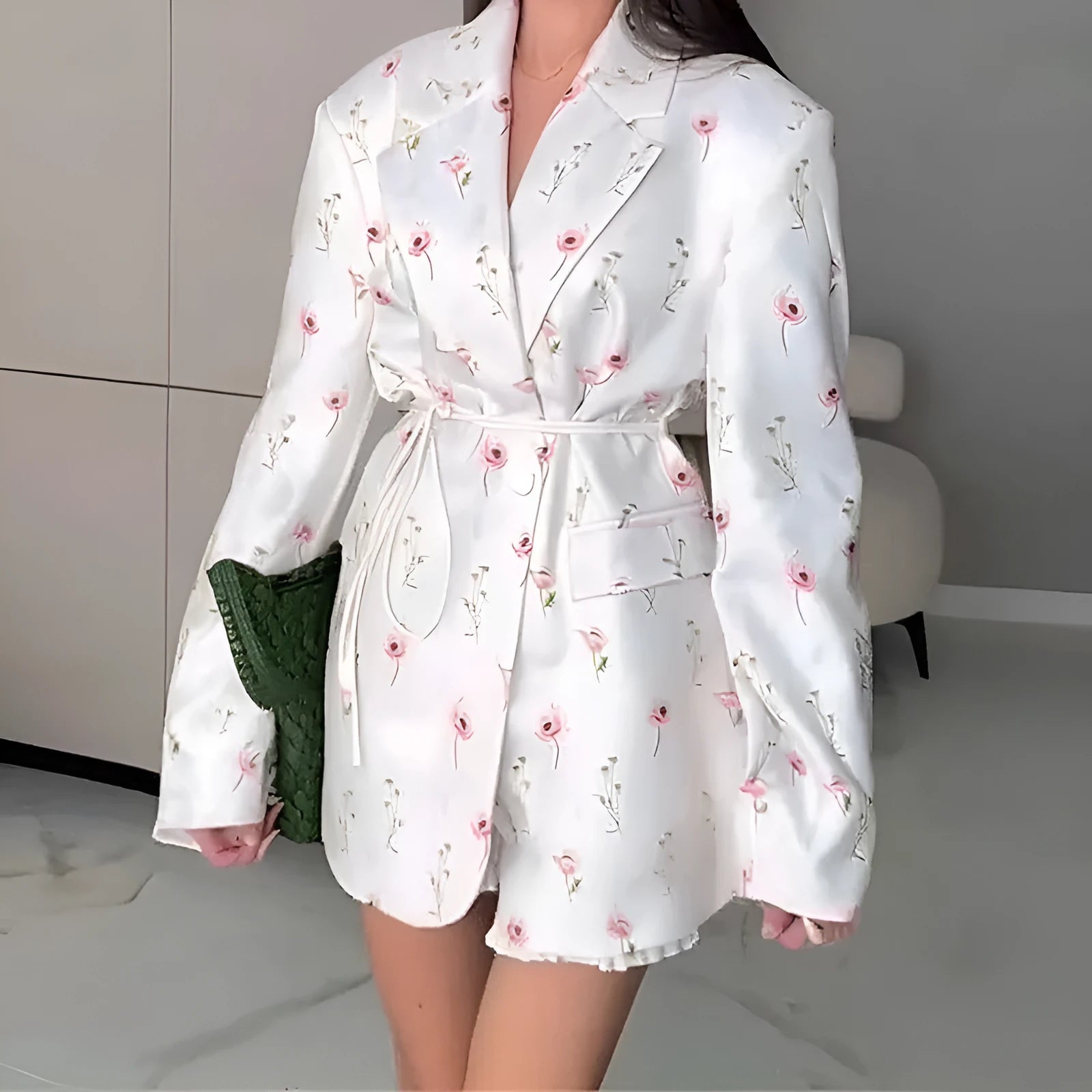 Women's white suit jacket with lace-up waist detail and collar, shown in regular fit with long sleeves