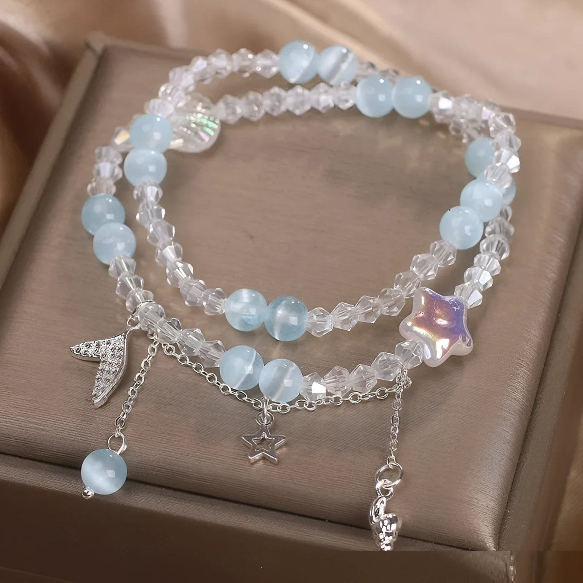 Light blue double circle aquamarine bracelet for women with two interlocking rings.