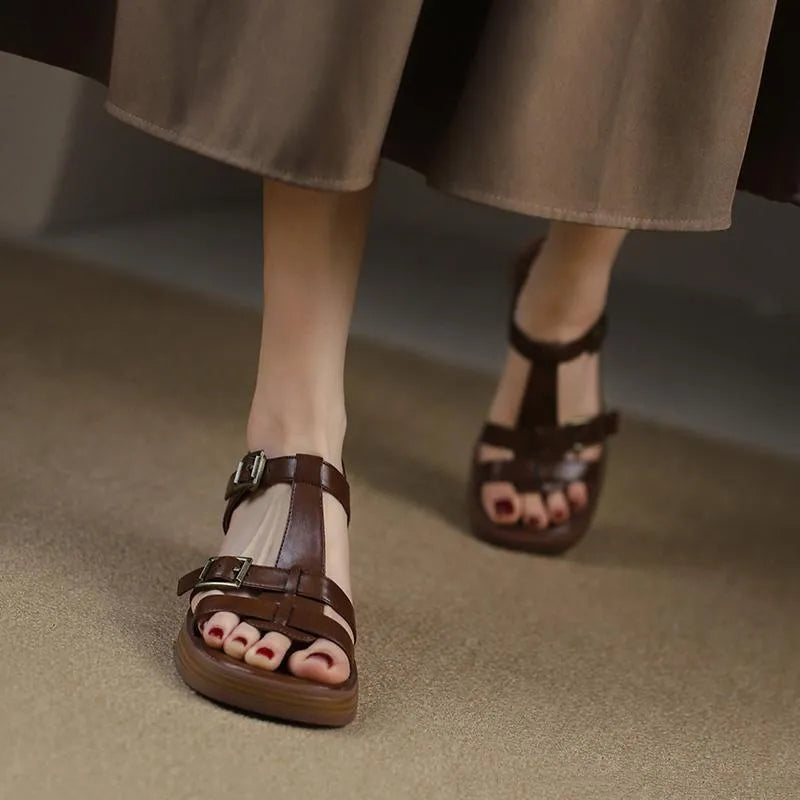Black women's retro sandals with T-shaped buckle, open toe, chunky platform heel, and square toe shape.