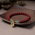 Gold cinnabar wave bracelet with copper beads in national style design