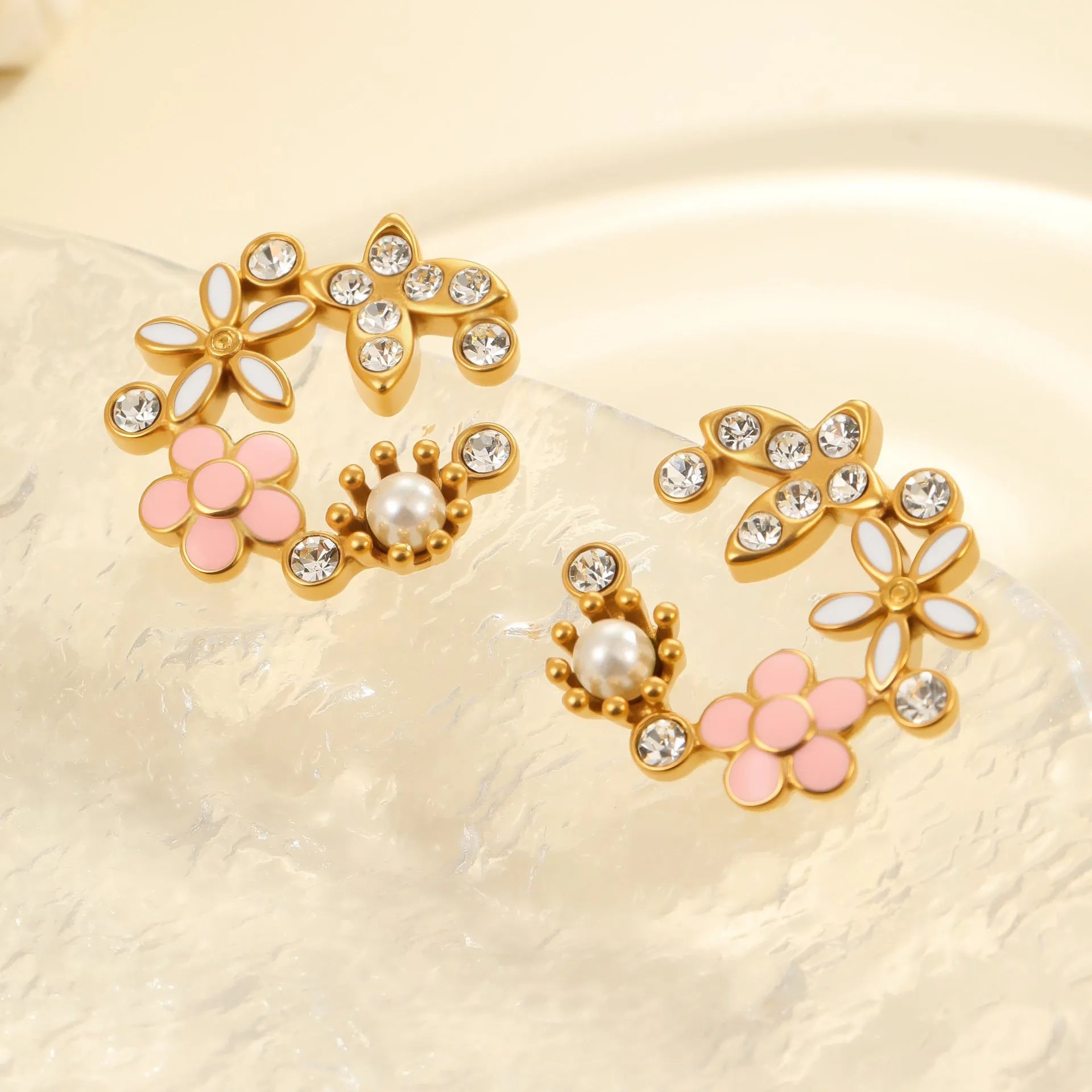 Gold-plated flower stud earrings with colourful oil diamond centre and petal design on stainless steel