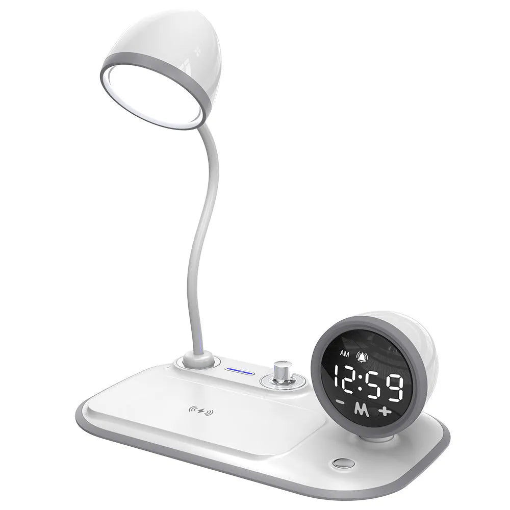 White three-in-one desk lamp with integrated digital clock and wireless charging pad on black desktop
