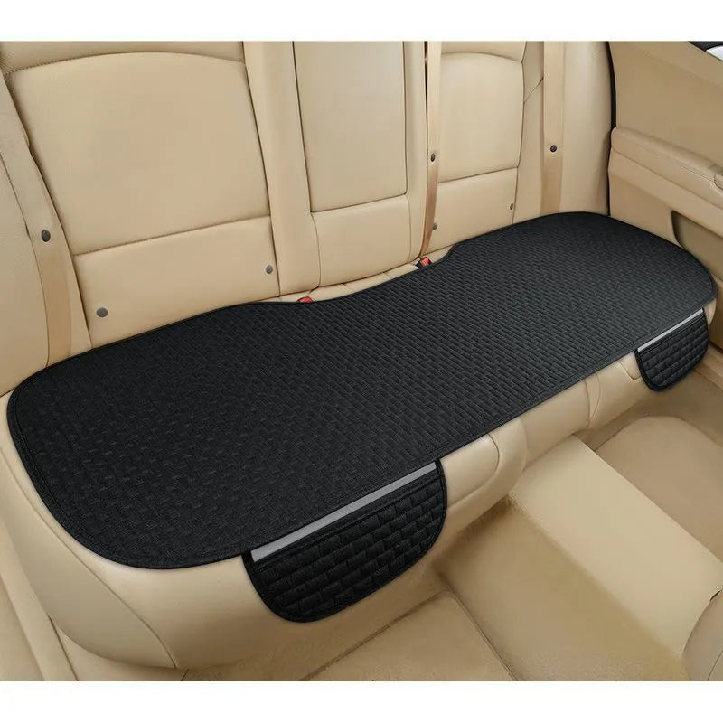Linen car cushion set showing classic black and red, coffee, and cream colour options with hemming edge detail