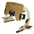 Wooden folding laptop table on a bed with adjustable angle, shown in white maple finish.