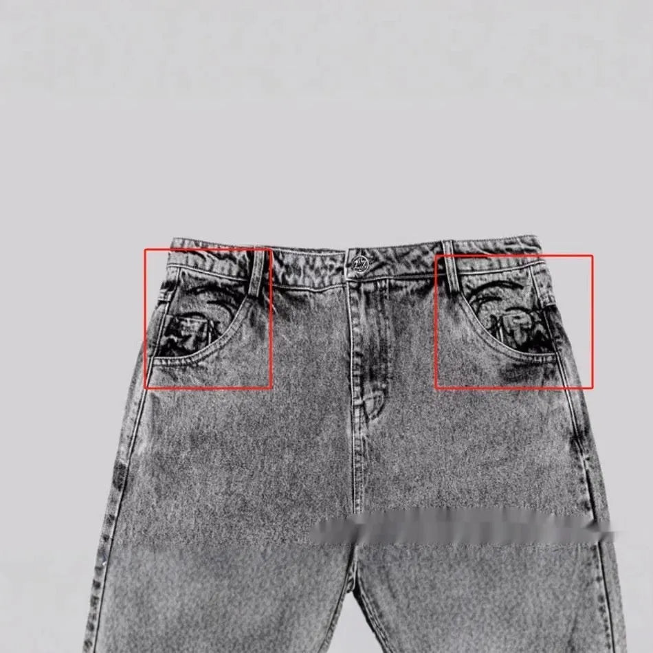 Grey loose straight-leg denim trousers on hanger showing mid-rise waist and cotton denim fabric