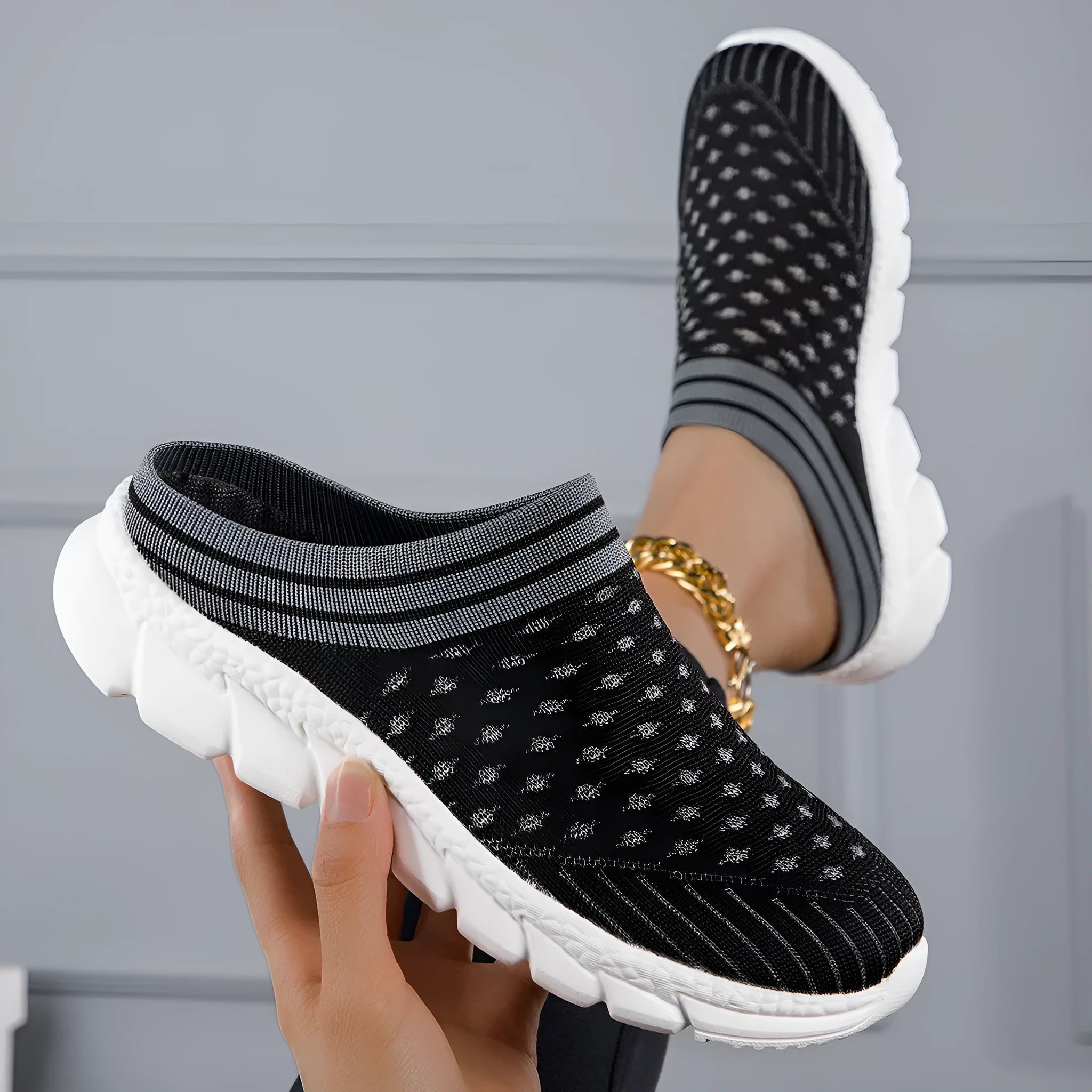 Women's black striped Flyknit casual slipper shoes with hollowed-out design and height increasing sole.