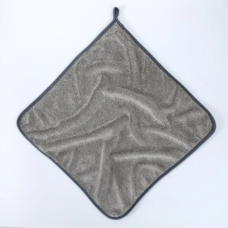 Small braid twisted car cleaning towel in grey with red edge trim, showing textured surface