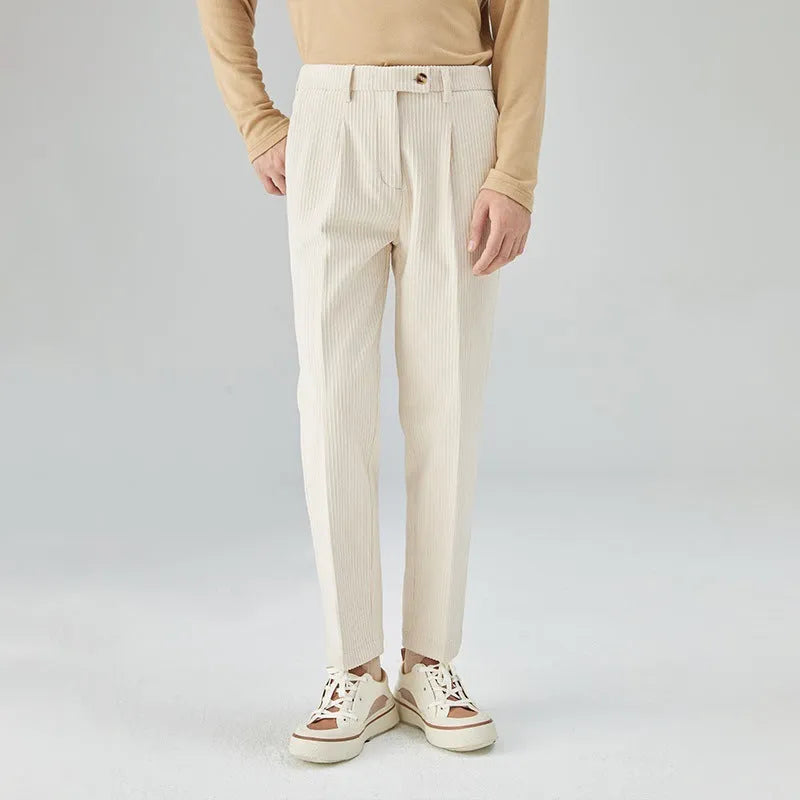 Men's straight-leg corduroy trousers in beige, showing loose fit and textured fabric