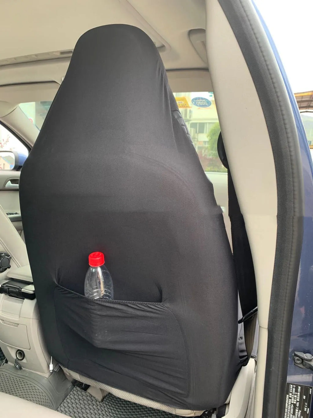 Black quilted automotive seat cover for universal car seats with plastic installation hooks
