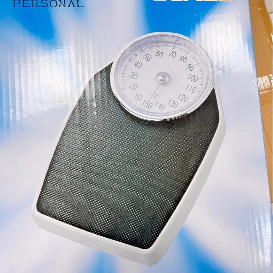 Black mechanical body weight scale with large analogue dial on a 47x35cm platform.