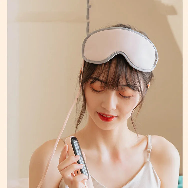 Green portable eye massage mask with suede exterior on a white background.