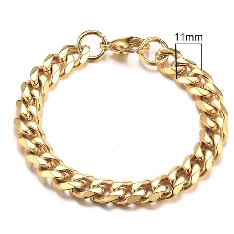 Six-sided Cuban link metal bracelet in gold, black, and steel colour finishes on a wrist.