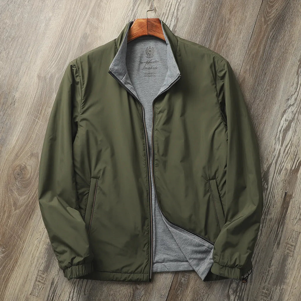 Men's plain stand collar jacket in a polyester cotton blend fabric, shown in blue.