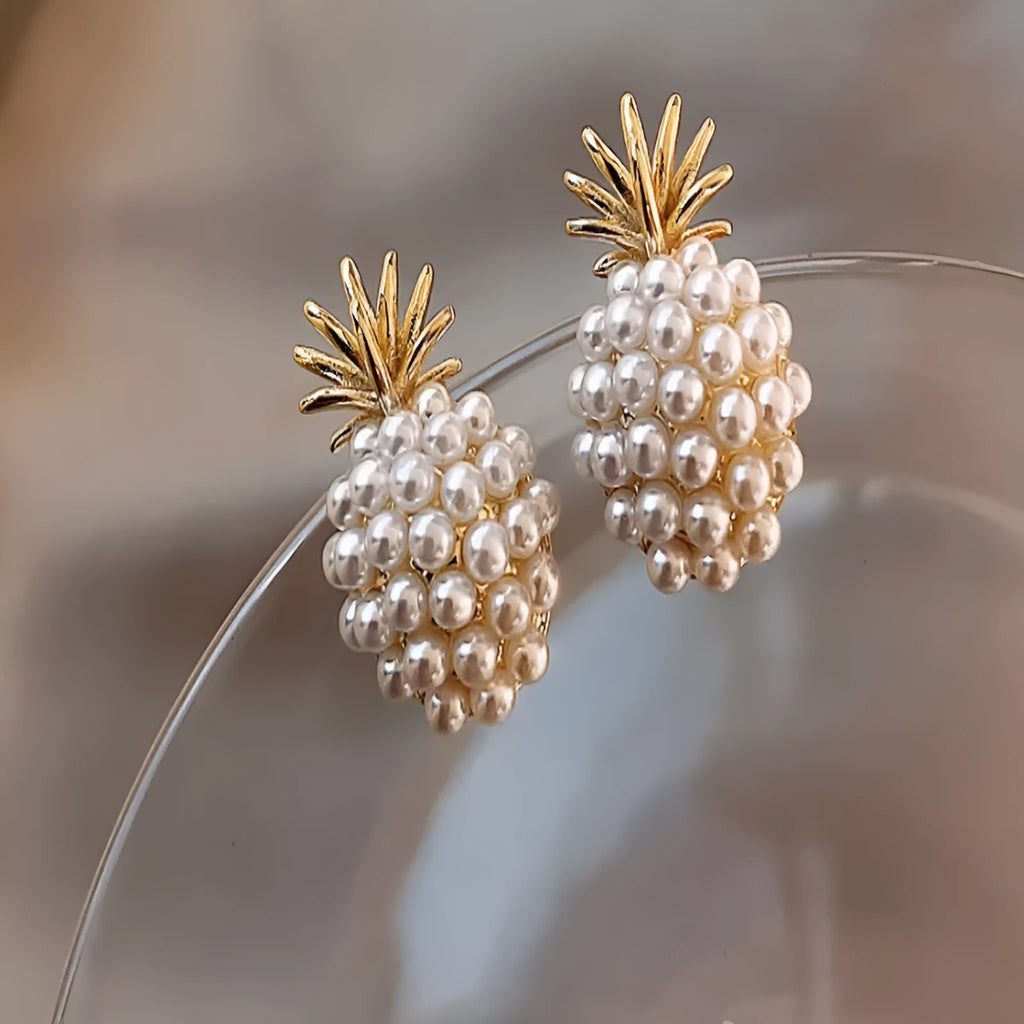 Korean-style pineapple starfish pearl earrings in electroplated alloy with decorative gemstones.