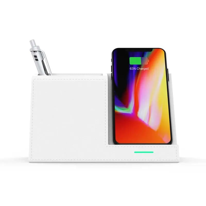 Black leather wireless charging station with pen holder slots showing phone charging on surface
