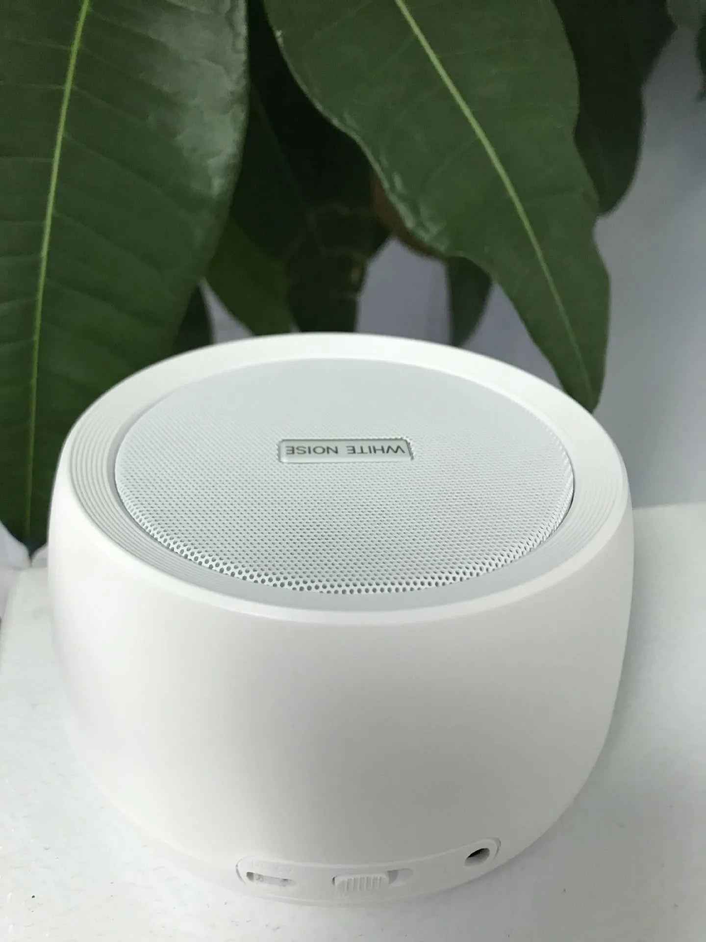 White noise sleep aid machine with compact USB design in white finish
