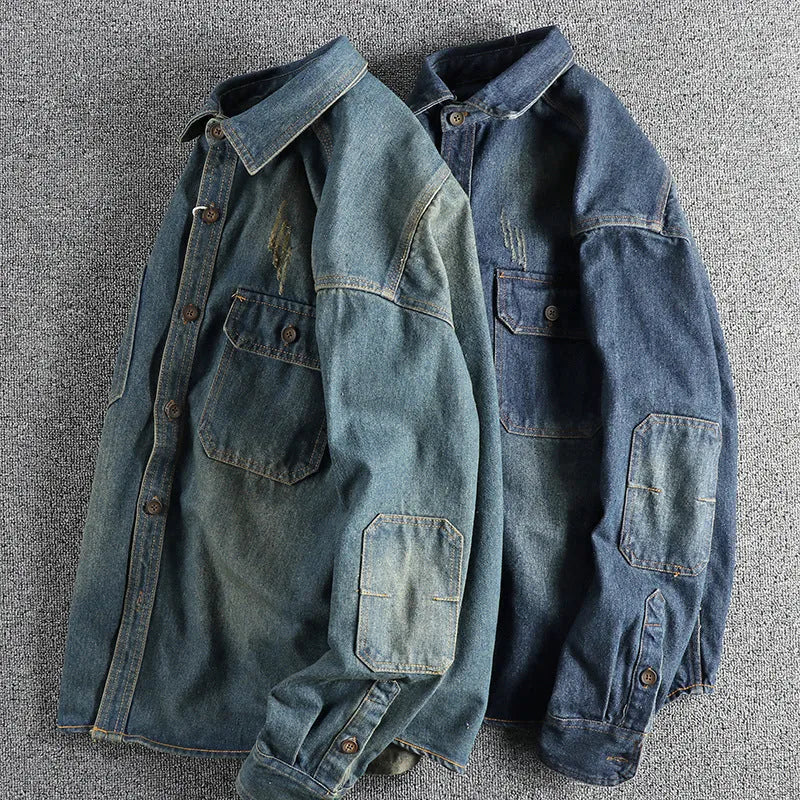 Man wearing a light blue loose-fit vintage denim shirt with long sleeves, cardigan style.