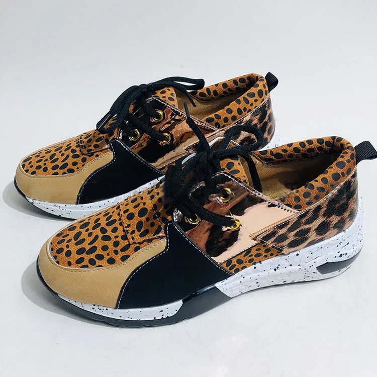 Women's suede flat sneakers with a wedge heel in black, leopard, pink, panther, and snake pattern colour options