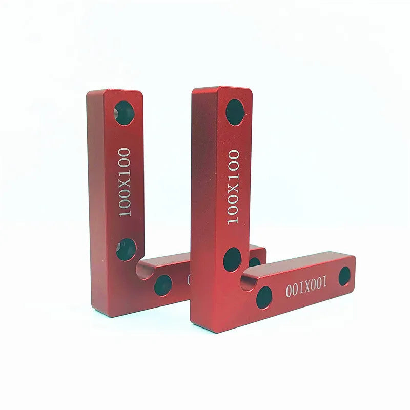 Aluminium right angle woodworking positioning block or jig on a workbench.