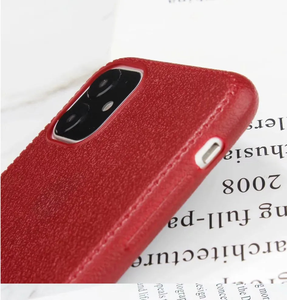 Leather phone case with TPU construction for iPhone, available in black, brown, navy blue and wine red.