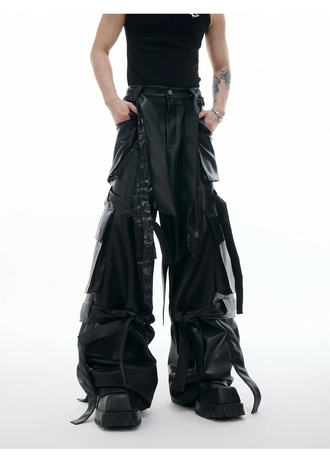 Men's black loose fit leather trousers with quilted detailing and multiple pockets
