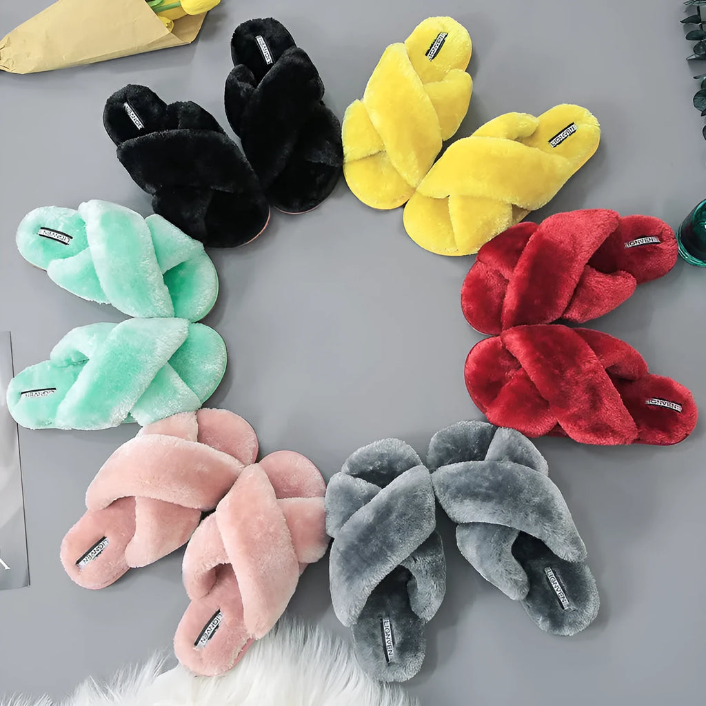 Cross open-toe fur slippers in various colours on a patterned non-slip sole.