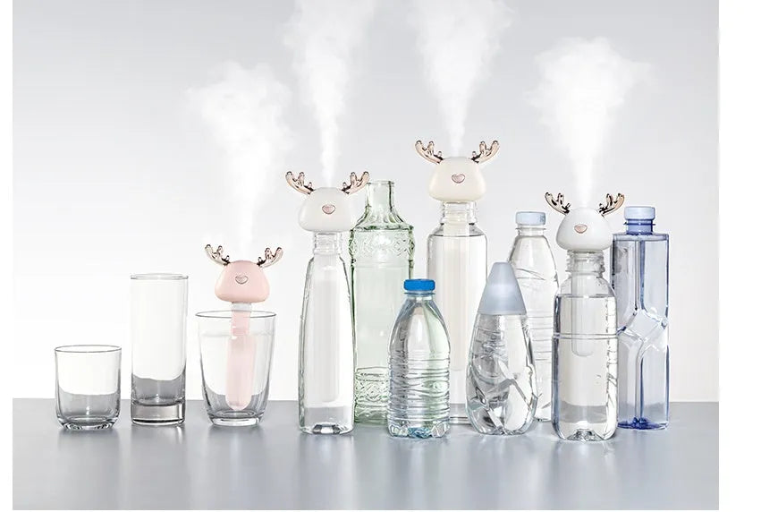 Mini USB portable car humidifier with creative little antler design in beige, showing water tank filler and USB cable