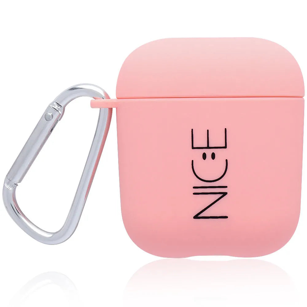 Black AirPods hard case with a smiley face design next to a pink case with a flower pattern.