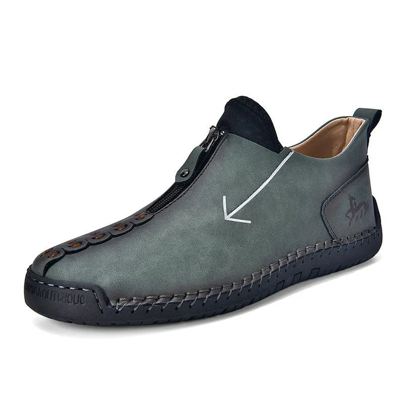 Men's black leather martin boots with front zipper and round toe design on rubber sole
