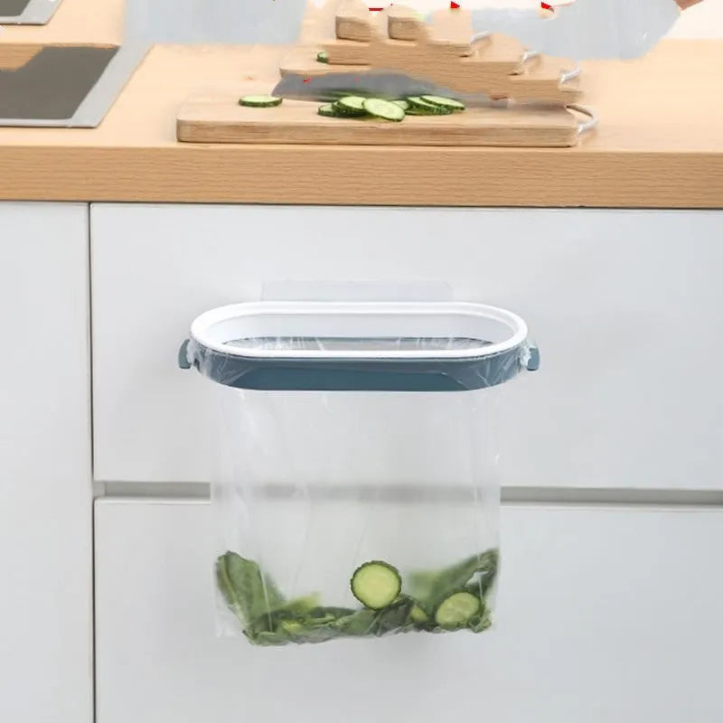 Blue plastic kitchen garbage bag storage rack mounted inside cabinet door