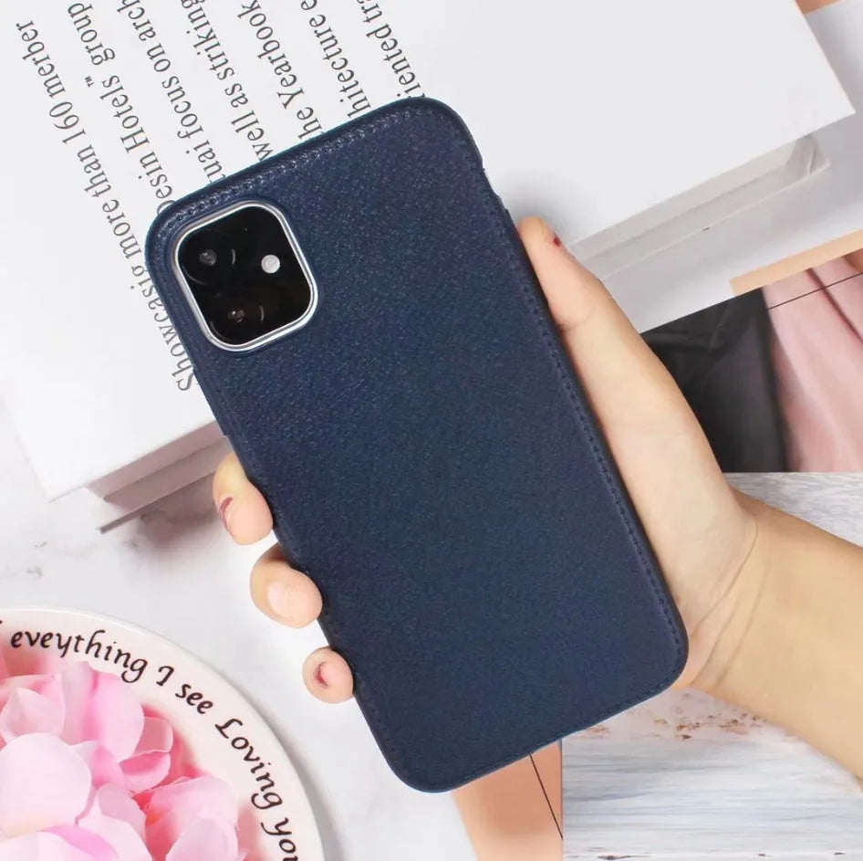Leather phone case with TPU construction for iPhone, available in black, brown, navy blue and wine red.