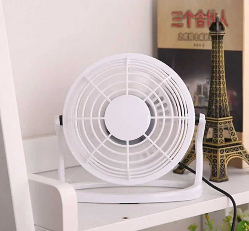 Mini USB desk fan in black colour with adjustable angle for computer cooling