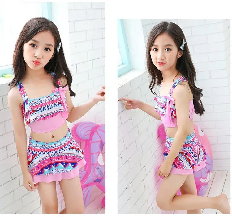 Kids two-piece bikini swimsuit in polyester fibre, available in blue or pink, sizes S to 3XL