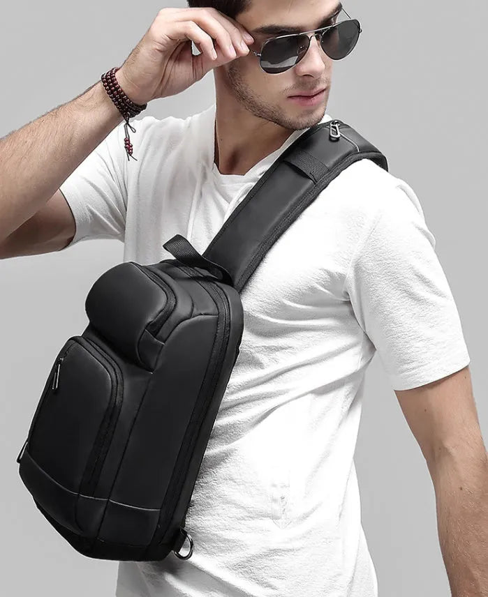 Black PVC outdoor leisure shoulder bag with air cushion strap and internal organiser pockets