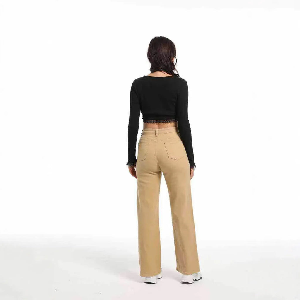 Women's high-waist wide-leg jeans in apricot colour, laid flat to show straight leg cut.