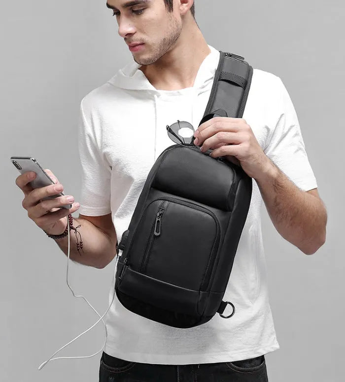 Black PVC outdoor leisure shoulder bag with air cushion strap and internal organiser pockets