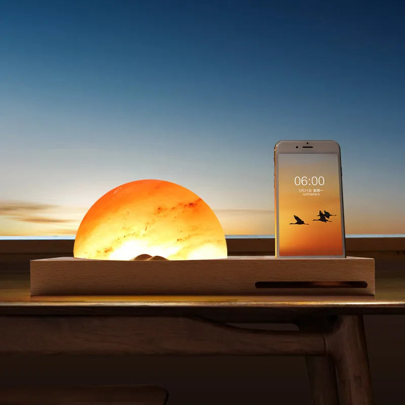 Natural crystal salt lamp with beech wood base featuring integrated wireless phone charging.
