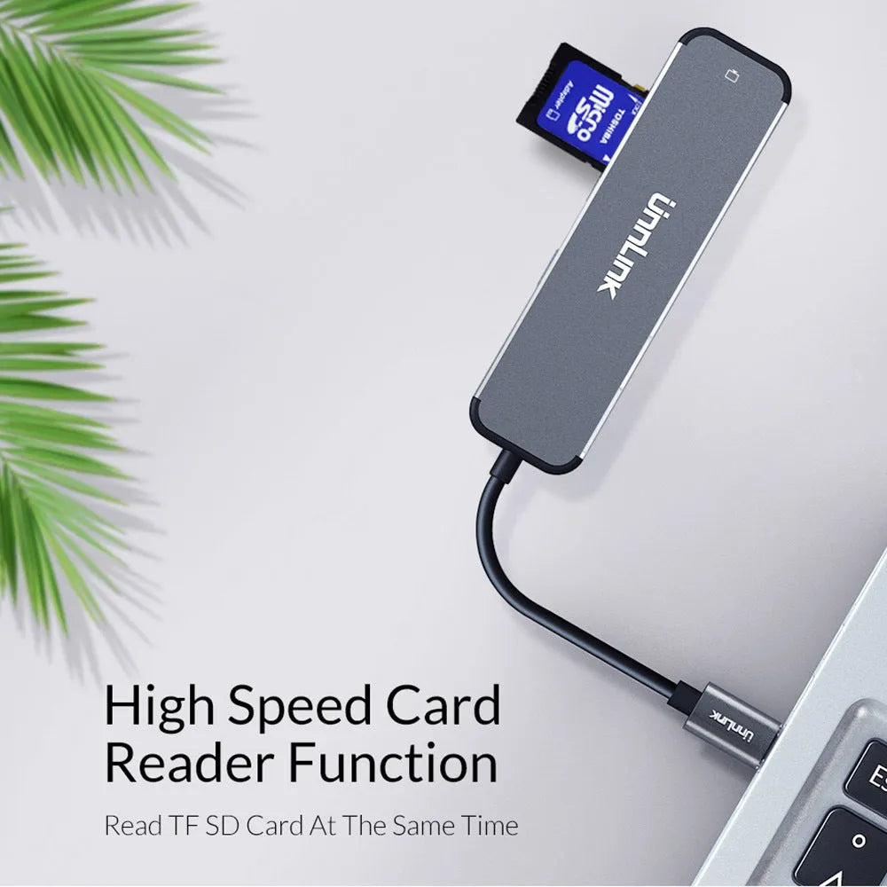 Silver aluminium alloy Type-C docking station with HDMI, SD, TF, and USB 3.0 ports, 4K 30Hz adapter