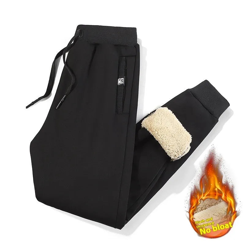 Men's gray fleece-lined oversized track pants with elastic waistband and straight leg