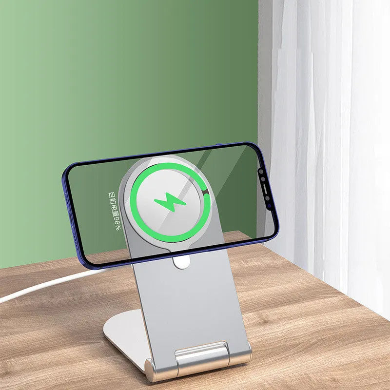 Silver vertical adjustable magnetic phone bracket for iPhone 12 on a desktop