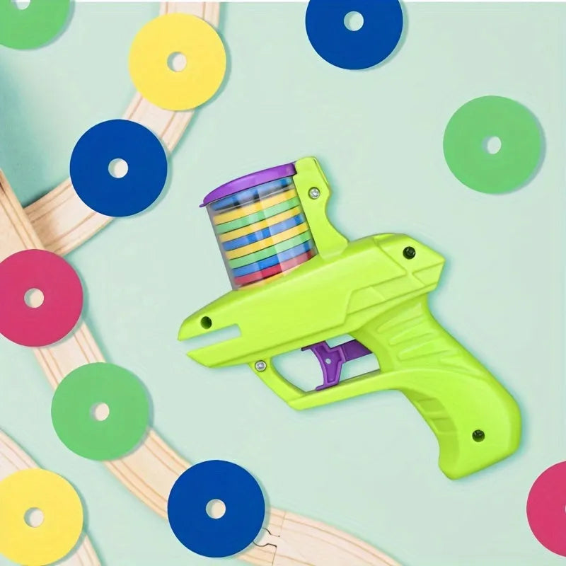 Interactive cat toy launcher with foam discs in green and purple colour options