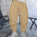 Man wearing loose-fit cropped casual trousers in bamboo fibre fabric, showing high elasticity and available colours.