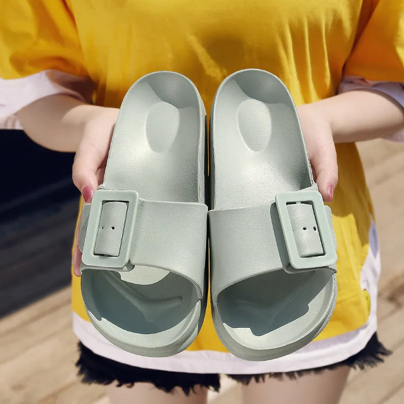 Women's grey blue EVA buckle sandals with an adjustable strap on a white background.