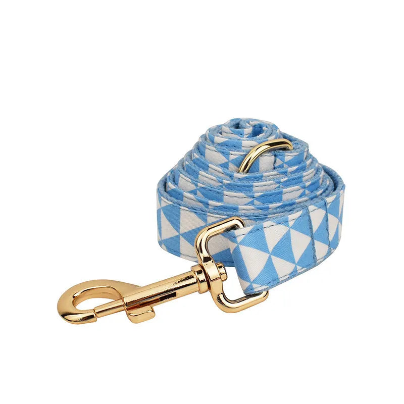 Blue triangular rope ring dog accessory set with matching vest, collar and bow decoration