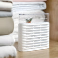 White recyclable cabinet dehumidifier box with clear top showing orange silica gel beads.