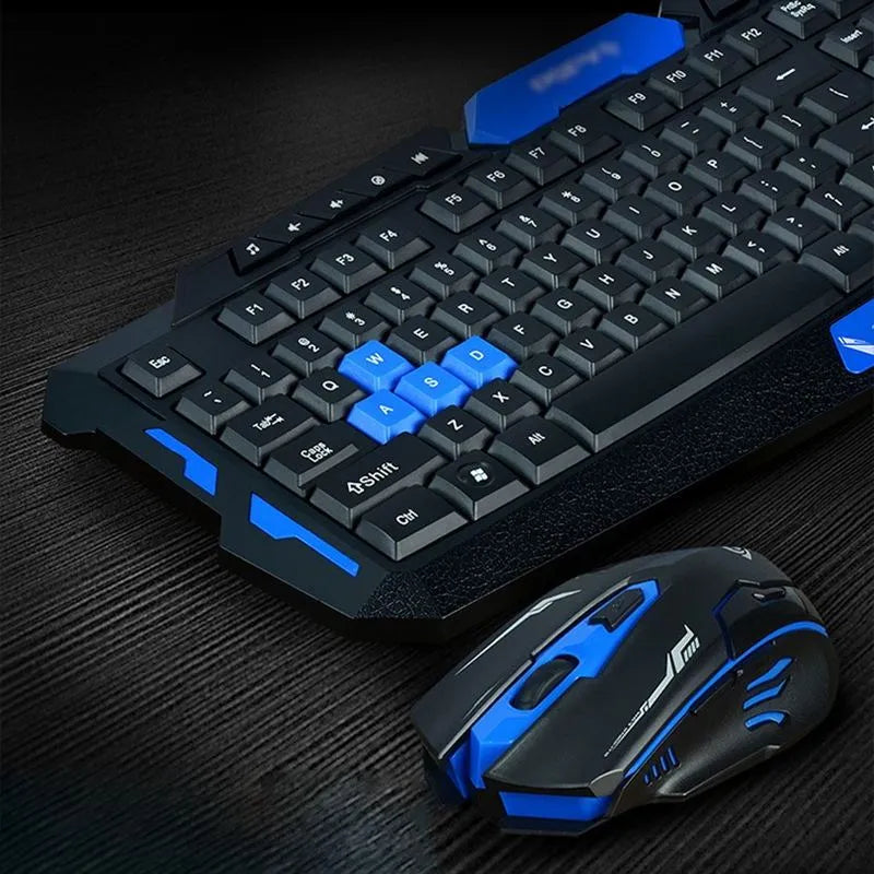 Black and blue wireless keyboard and mouse set on desk with gaming and work applications