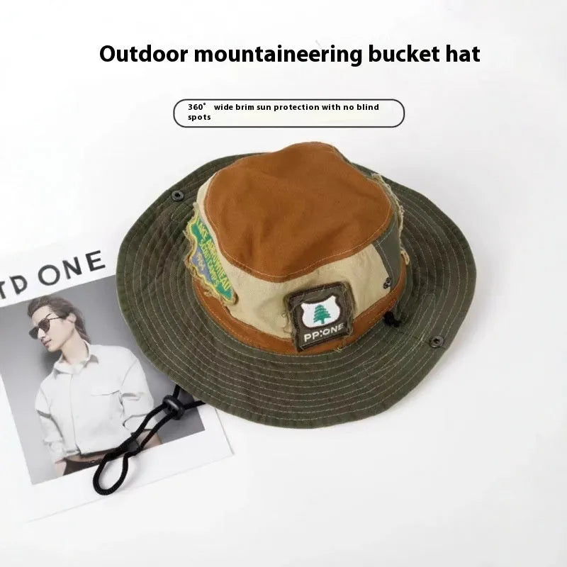 Army green cotton fisherman hat with retro patchwork details and flat top crown for summer sun protection