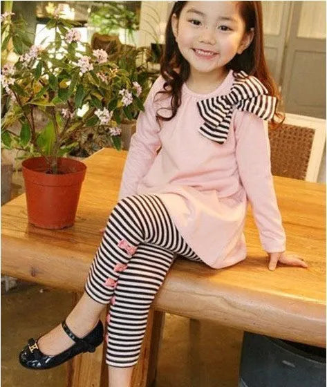 Girls pink cotton two-piece clothing set showing matching coordinated outfit