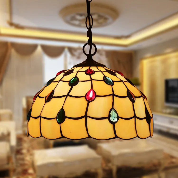 European retro baroque style chandelier with coloured glaze finish and abstract shapes.
